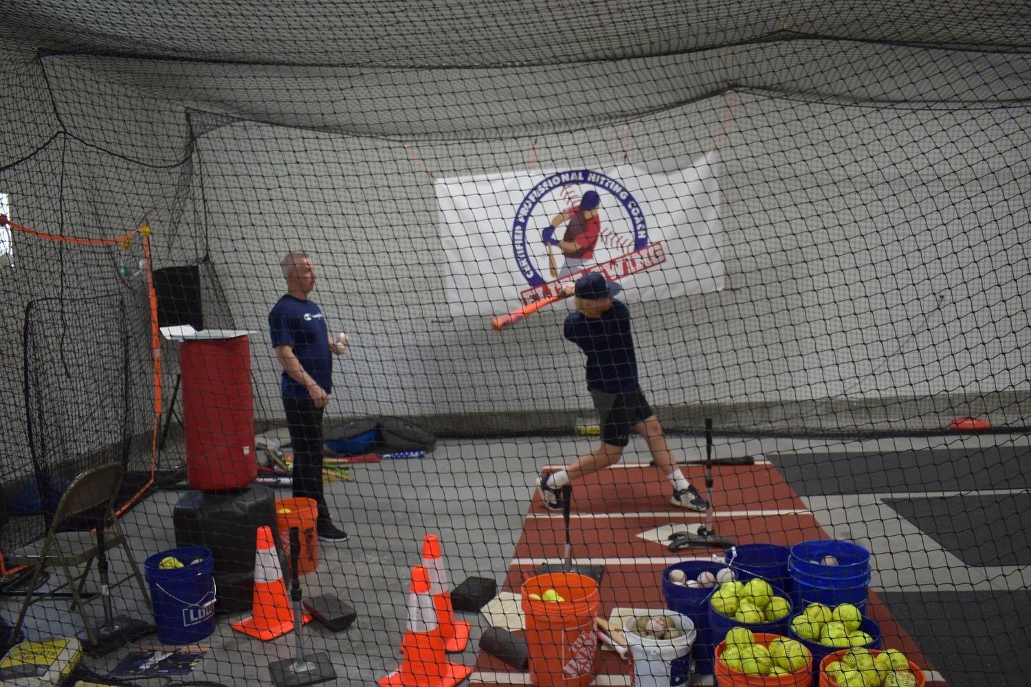 Elite Swing batting cage with buckets of practice balls